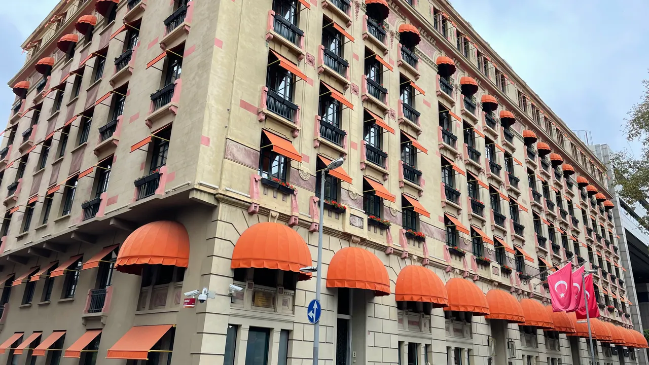 Maçka Palas building exterior with orange awnings in an archival 2021 street photograph